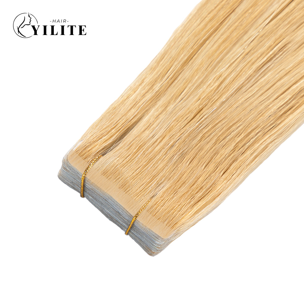 Close-up of (#27) Strawberry Blonde Narrow Mini Tape In Hair Extensions 