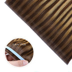 Close-up of (#P4/27/T4) Chocolate Brown to Caramel Blonde Tape Weft Hair Extensions